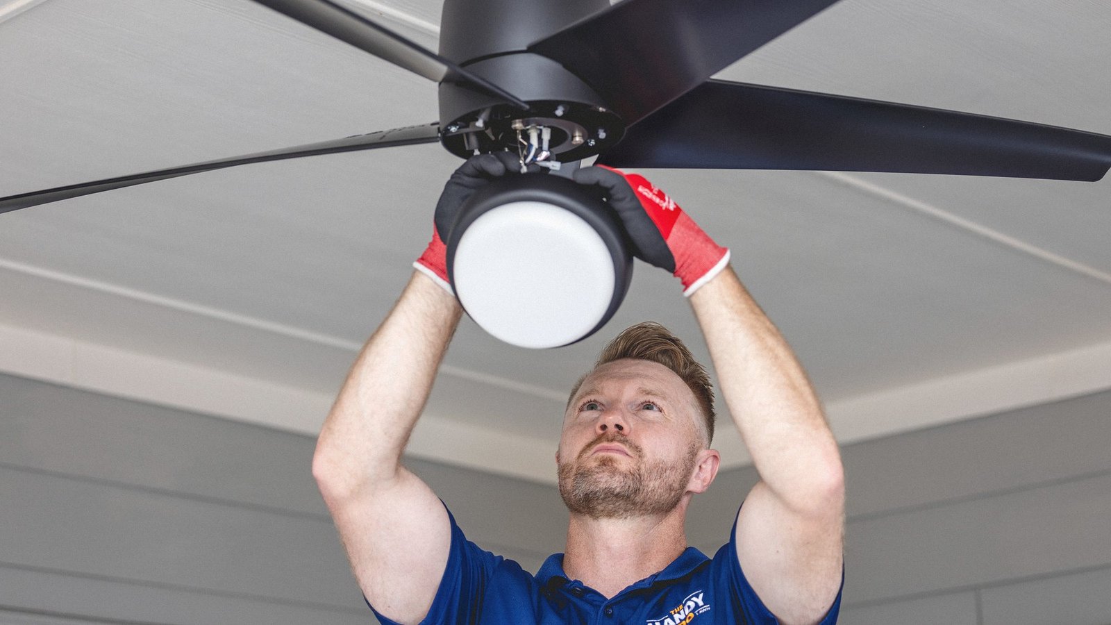 Warren Wiedenfeld of The Handy Bro fitting a light kit to a ceiling fan